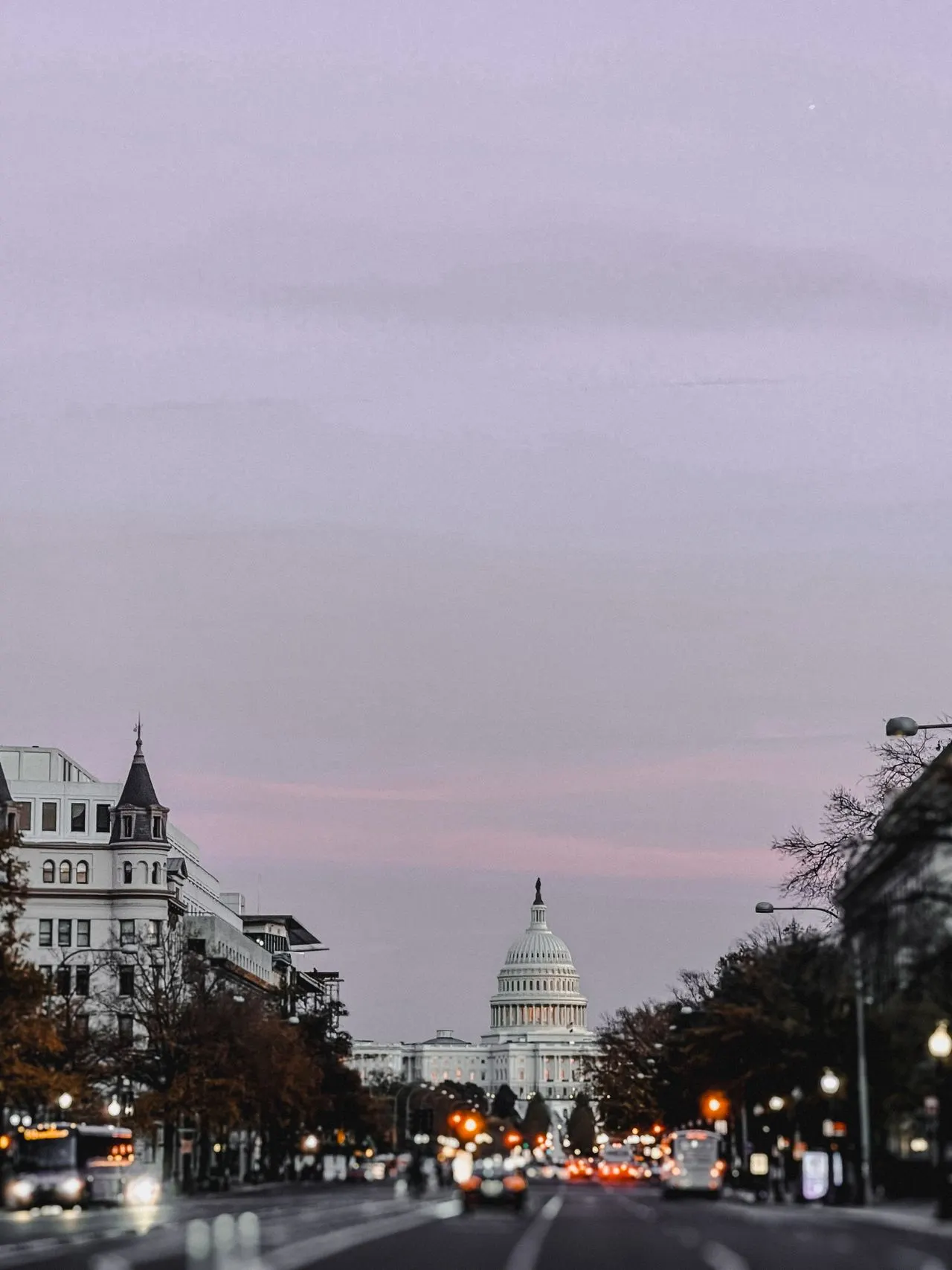 Washington DC Capitol Building at dusk viewed from Pennsylvania Avenue